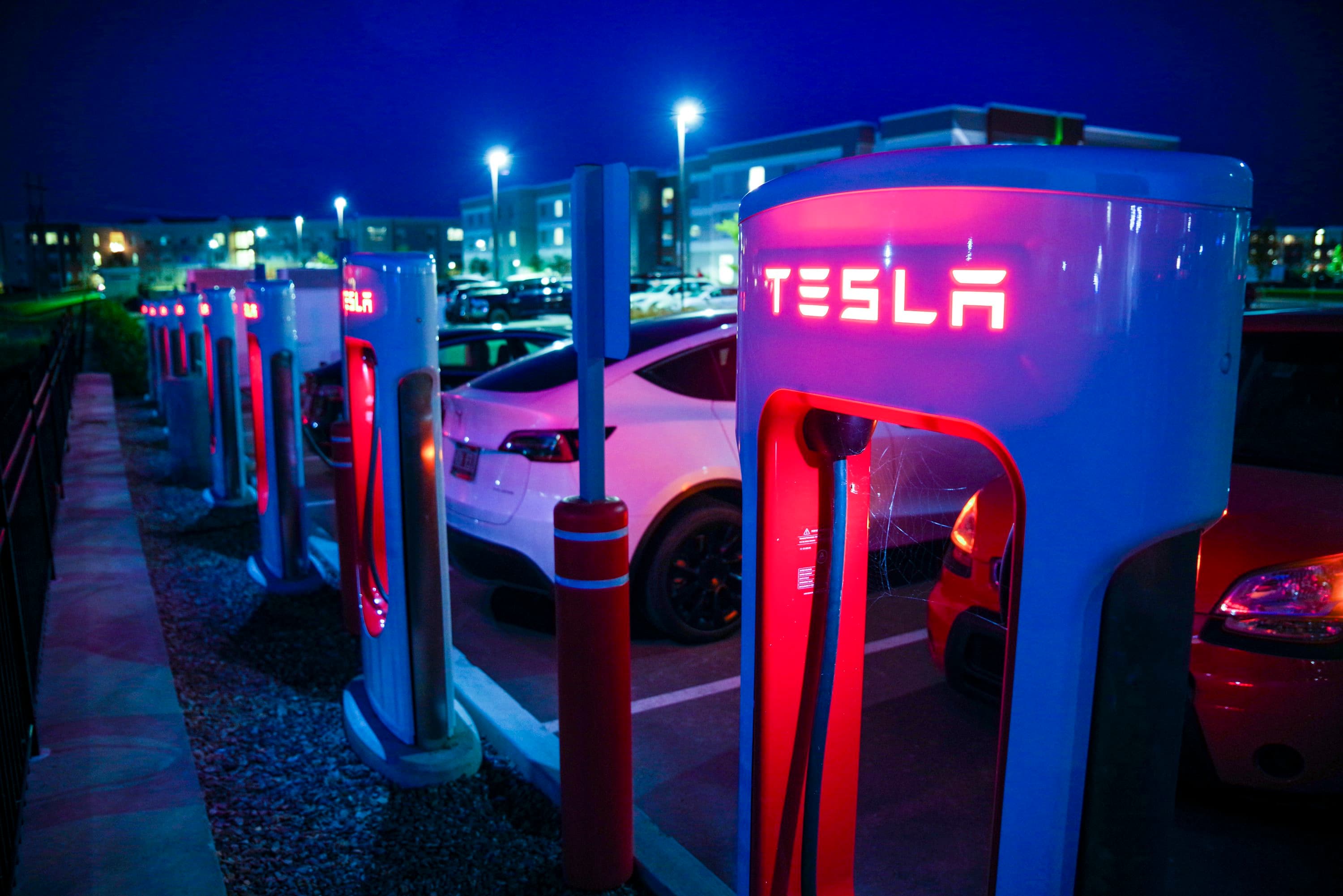 Tesla supercharger station at night